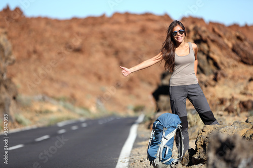 Photo: Travel woman hitchhiking Travel woman hitchhiking