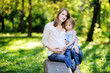 Pregnant mother with her small daughter outdoors
