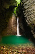 Beautiful waterfall in a cave. Kozjak, Alpine Slovenia Beautiful waterfall in a cave. Kozjak, Alpine Slovenia