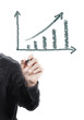 businessman drawing graph