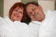 Happy elderly couple in bathrobe