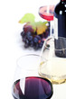 Glasses of white, red and rose wine and grapes