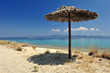 Beach umbrella on a sunny day, sea in background Beach umbrella on a sunny day, sea in background