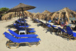 view of chairs and umbrella on the beach view of chairs and umbrella on the beach