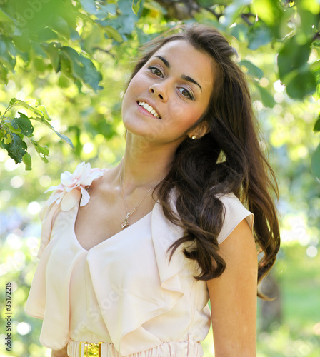 Photo: endearing cute girl in the beautiful morning park endearing cute girl in the beautiful morning park