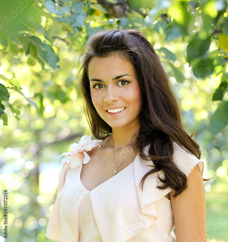 Photo: endearing cute girl in the beautiful morning park endearing cute girl in the beautiful morning park