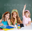 boring sad student with clever children girl raising hand