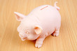 Piggy-bank on a wooden table