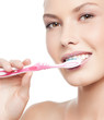 woman brushing her teeth