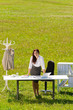 Businesswoman in sunny meadow nature office smile