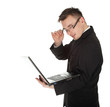 young businessman in black suit working on laptop