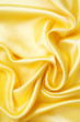 Smooth elegant golden silk as background Smooth elegant golden silk as background