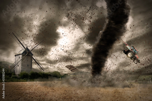Photo: Large tornado over a wind mill Large tornado over a wind mill