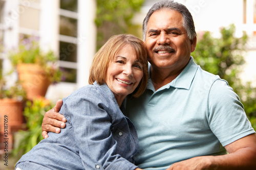 Photo: Senior couple relaxing in garden Senior couple relaxing in garden