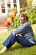 Senior woman relaxing in garden
