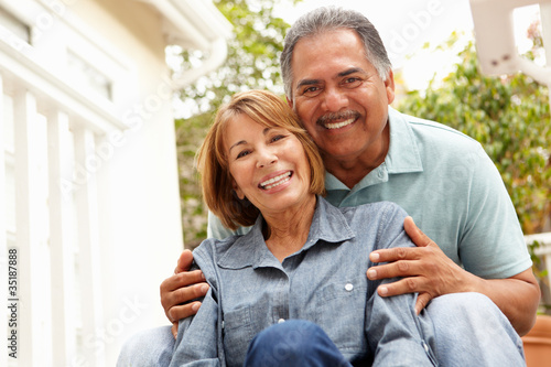 Photo: Senior couple relaxing in garden Senior couple relaxing in garden