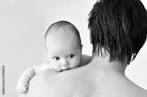 Photo: baby on father's shoulder baby on father's shoulder