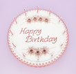 Top view of birthday cake with candles and roses Top view of birthday cake with candles and roses