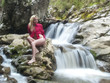sexy blonde posing near cascade