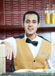 Cheerful arab barman