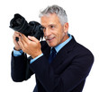 Elderly businessman using a professional camera Elderly businessman using a professional camera