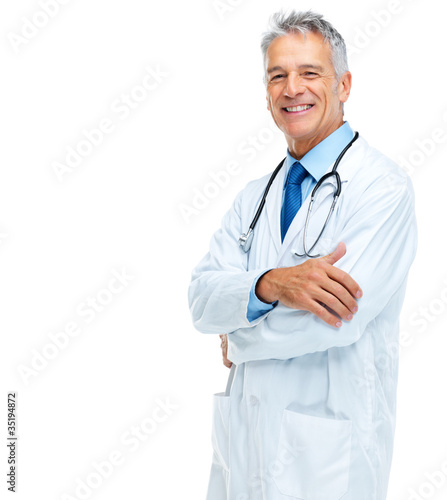 Foto: Smiling senior doctor standing confidently Smiling senior doctor standing confidently