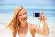Smiling woman with digital camera Smiling woman with digital camera