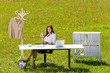 Businesswoman in sunny meadow relax nature office