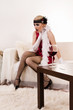 Sensual young lady in red choking