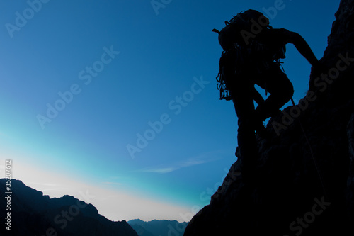 Photo: Silhouette of a climber with large copay space Silhouette of a climber with large copay space