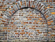 Cut out rocks in wall with arched brickwork