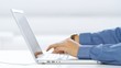 Businessman using mobile phone and laptop computer