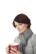 Photo: Junge Frau hält nachdenklich Kaffeetasse Junge Frau hält nachdenklich Kaffeetasse