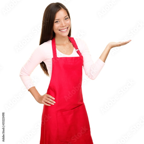 Foto: Small shop owner sales assistant showing Small shop owner sales assistant showing