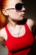 Fashionable hip-hop girl posing in studio