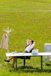 Businesswoman in sunny meadow relax nature office