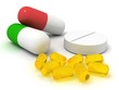 Pills and capsules on white