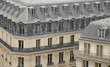 Paris buildings with characteristic roofs and balconies