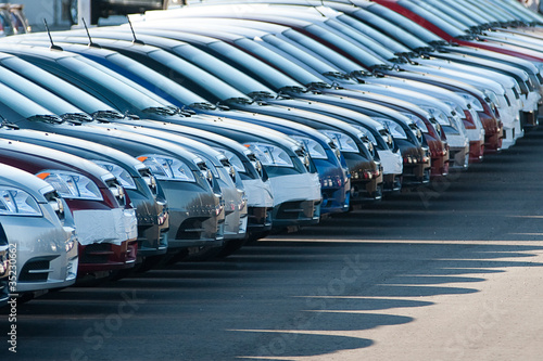 Photo: Row of unsold new cars Row of unsold new cars