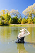 woman fishing in pond