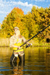 woman fishing in pond
