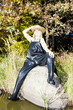 fisher woman sitting on stone