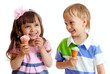happy children twins girl and boy with ice cream in studio isola