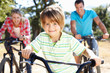 Young family on country bike ride
