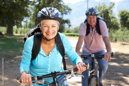 Photo: Senior couple on country bike ride Senior couple on country bike ride