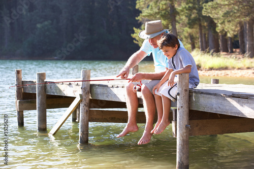 Photo: Senior man fishing with grandson Senior man fishing with grandson