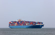 containership entering the harbour of rotterdam