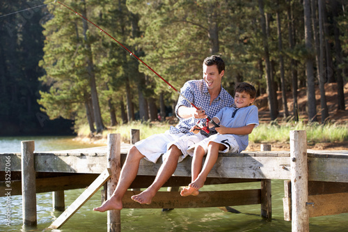 Photo: Father and son fishing together Father and son fishing together