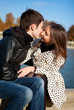 Photo : Romantic couple kissing in autumn park Romantic couple kissing in autumn park