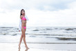 Young and beautiful brunette relaxing on the beach